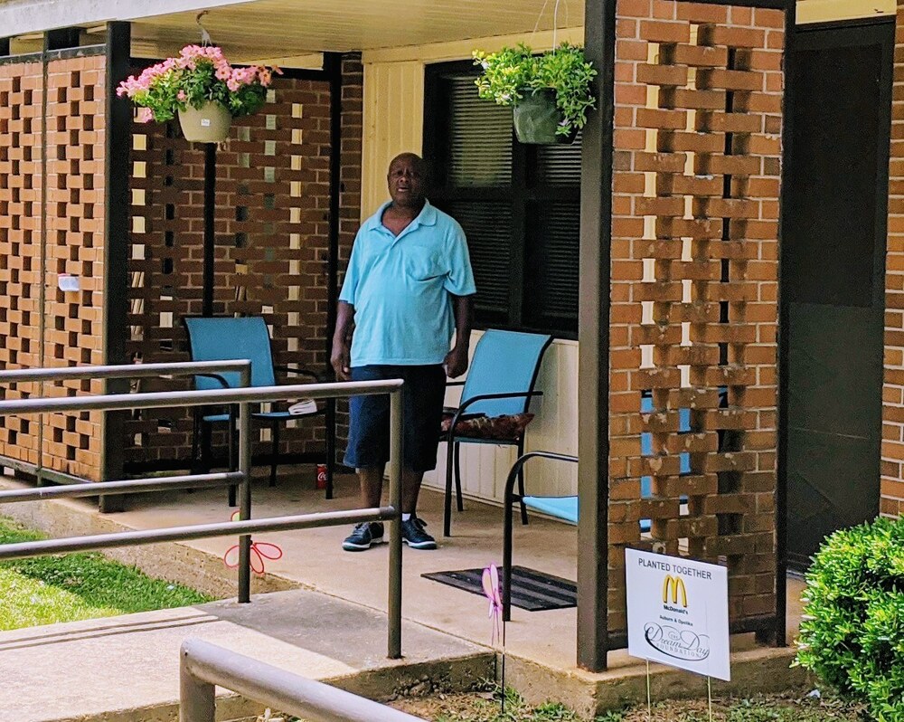 planted together resident standing outside