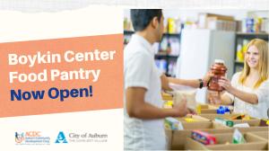 banner boykin pantry open with lady handing man a canned food