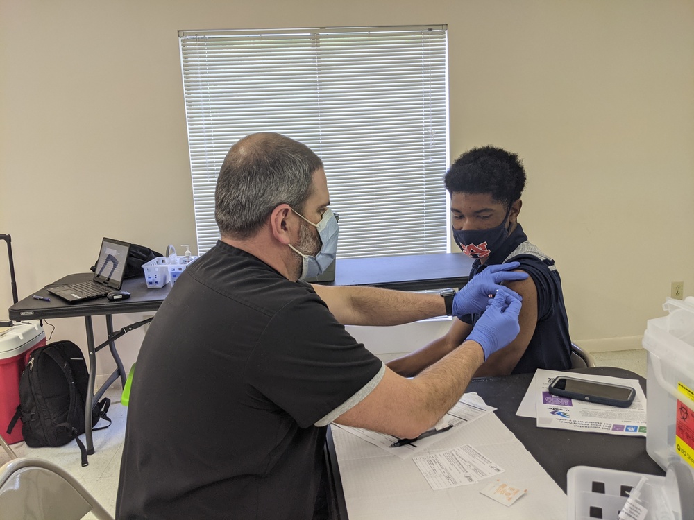 male receiving vaccination