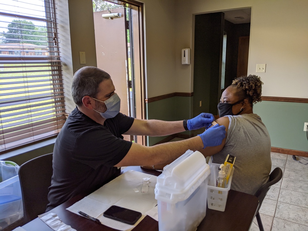 female receiving vaccination for covid19