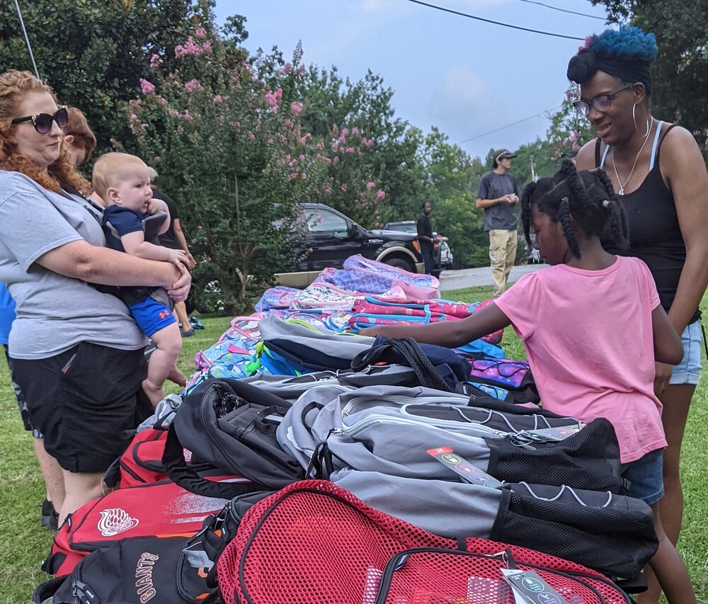 Back to School 3 families picking out bookbags