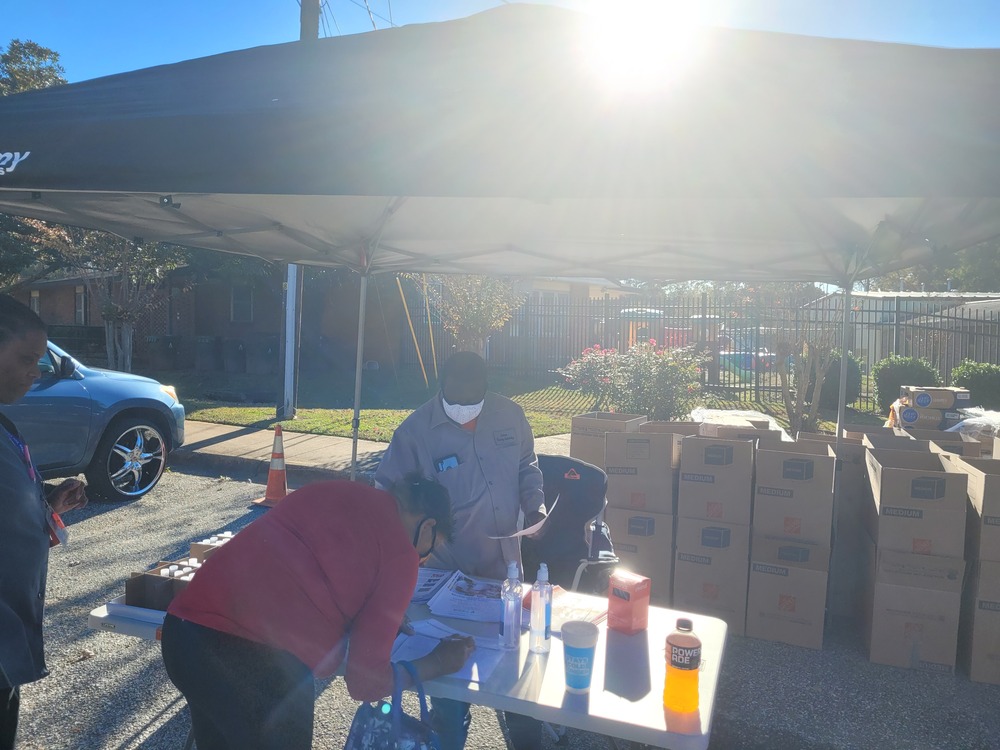 Thanksgiving Farmers Market Attendees at desk 