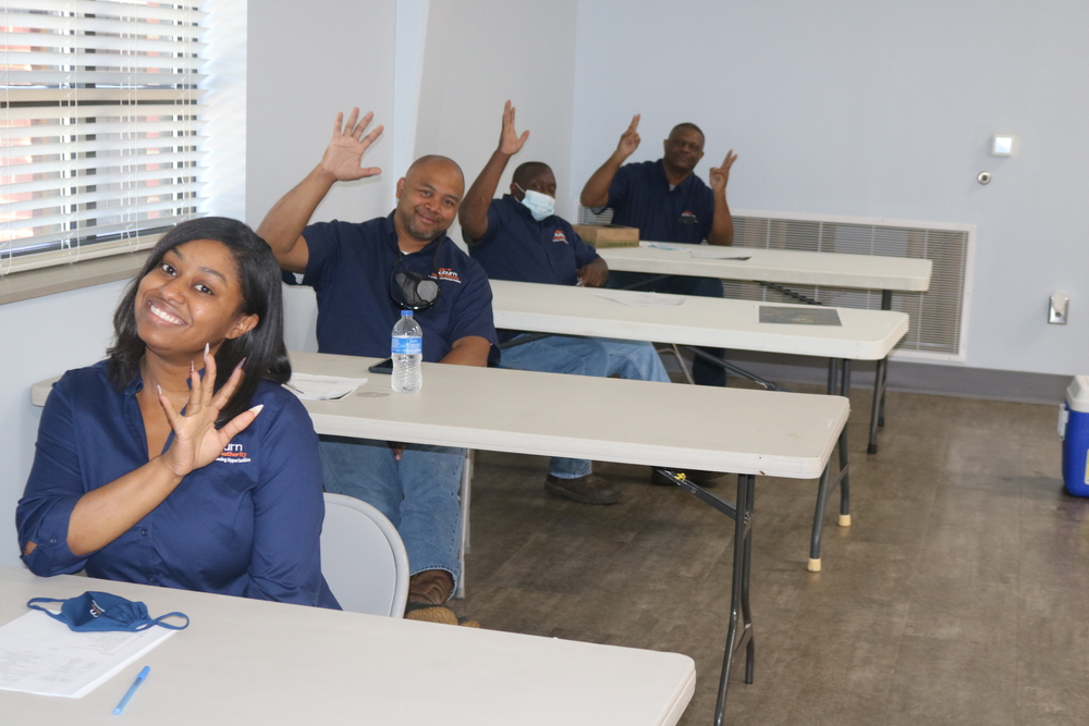 Annual Meeting Employee smiling and waving