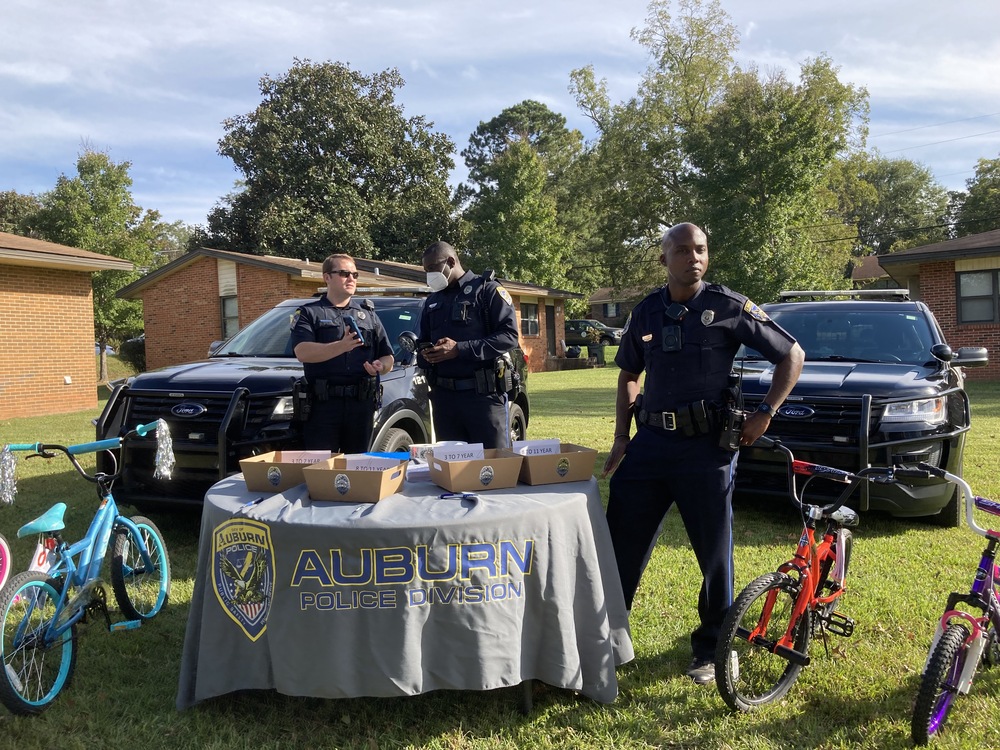National Night Out 2021 Auburn Police departments with bikes for kids