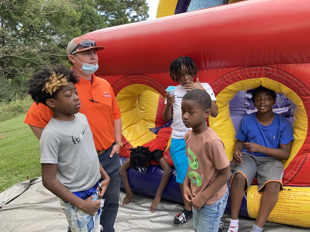 National Night Out 2021 kids outside of a bouncy house