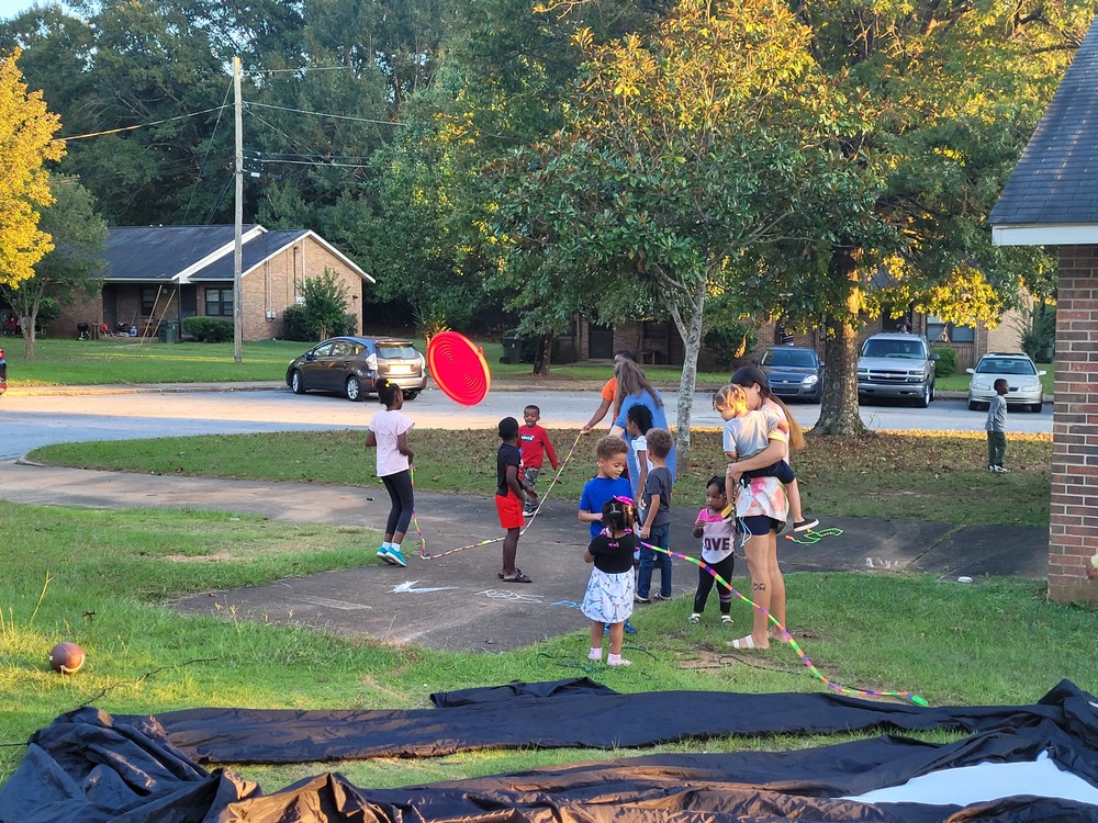 Sparkman Movie Night kids playing games outside jump rope