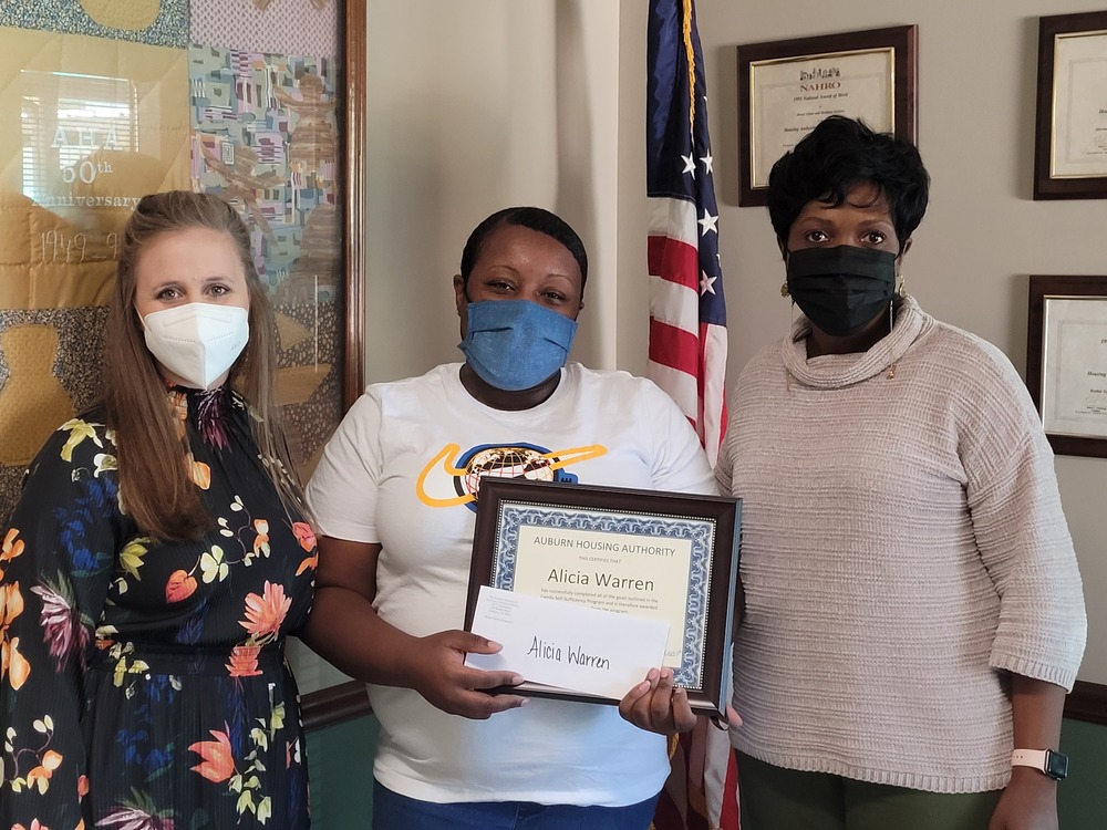 Fss Alicia Warren Graduate receiving awards from CEO Sharon Tolbert and Rachel Harris