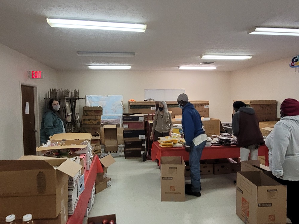 LHA Holiday Market food boxes inside building