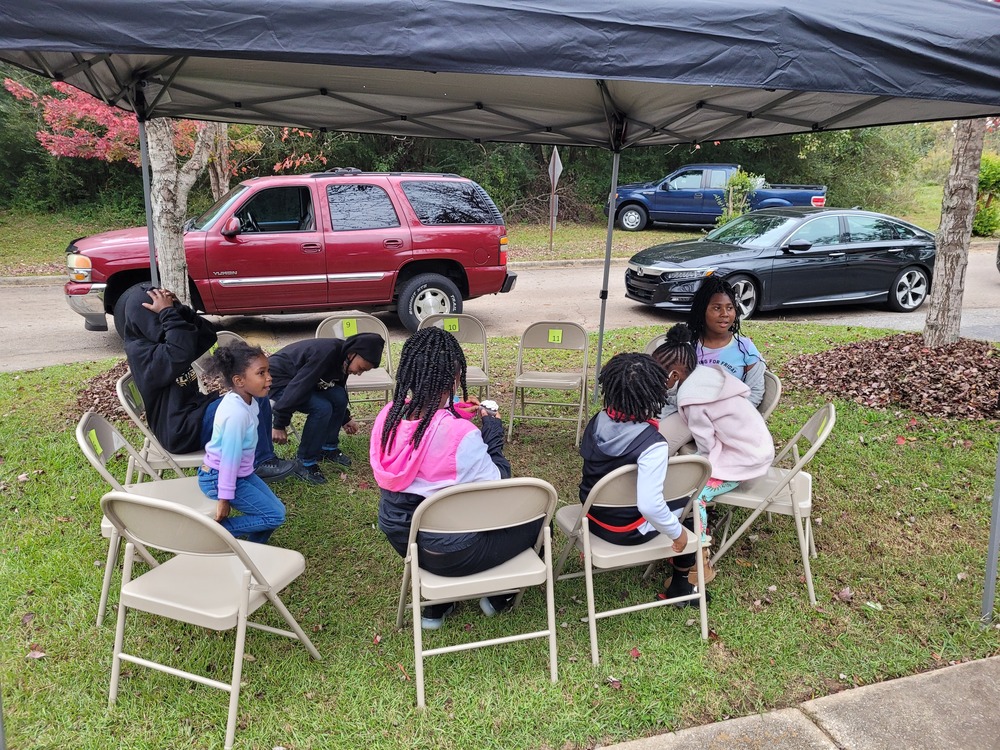 LHA Tailgate youth sitting in folding chairs
