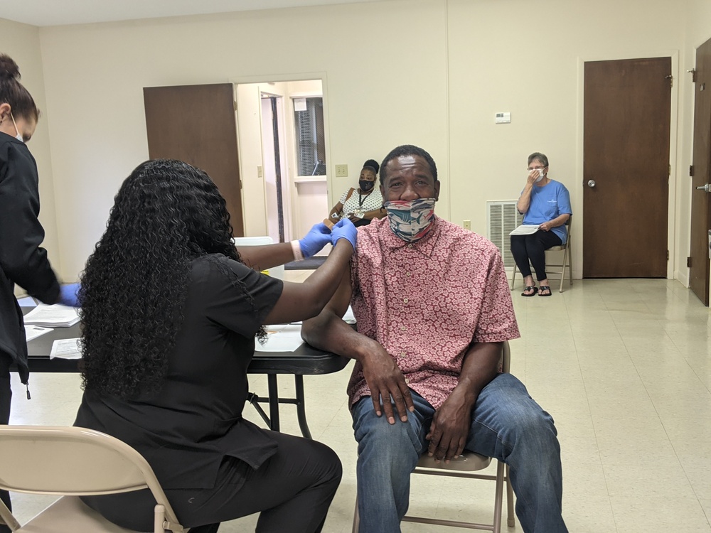 Black male receiving Covid19 vaccine