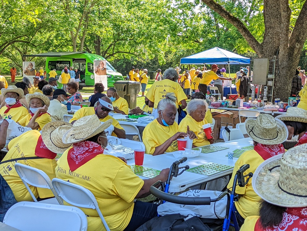 View of Older American event attendees eating lunch at tables