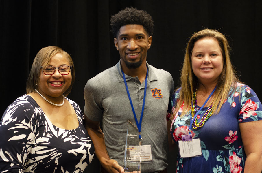 Shaundra Clark, AJ Harris, and another attendee at the SERC Annual Awards