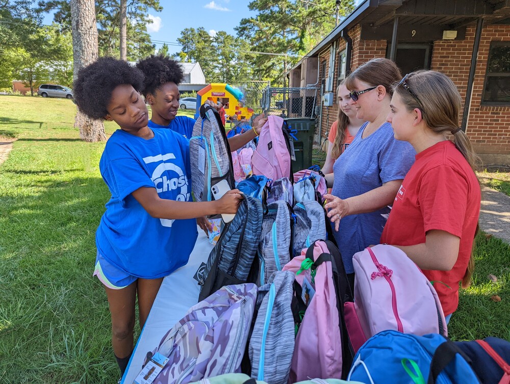 AHA Back to school youth picking out a backpack