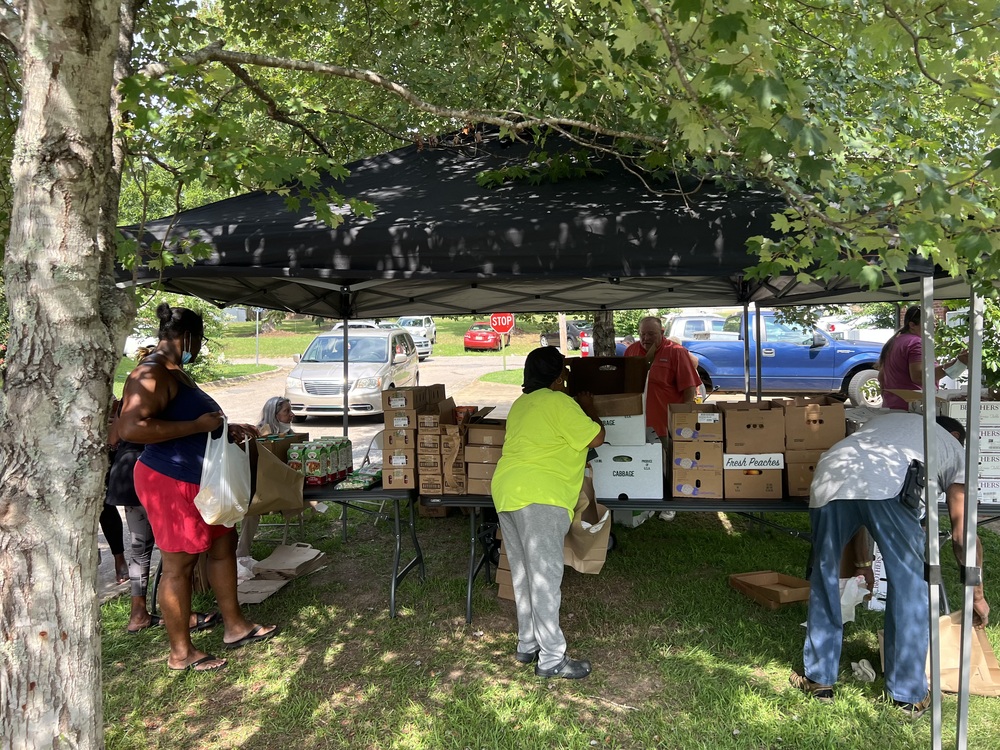 LHA Farmers Market attendees under tent