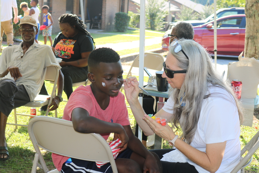 LaFayette Tailgate party young boy getting his face painted