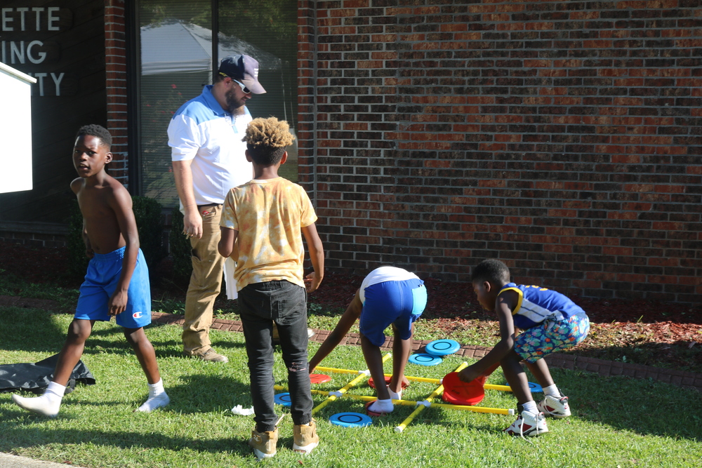 LaFayette Tailgate party kids playing outside on lawn