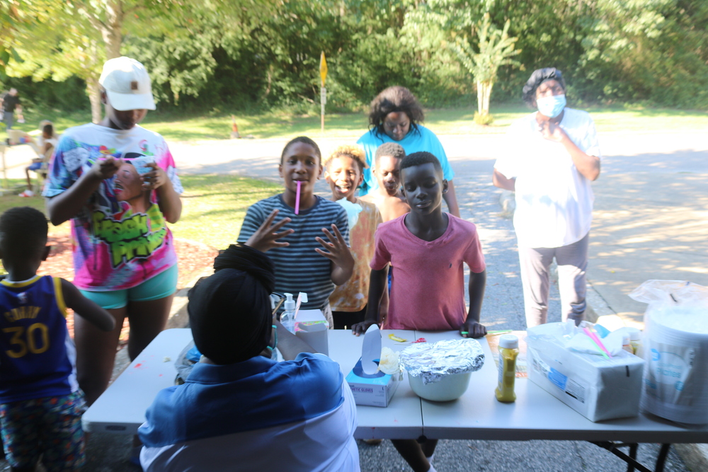 LaFayette Tailgate party youth at  popsicle table