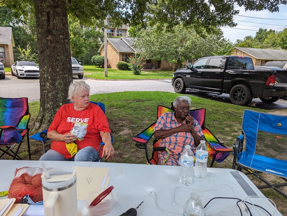 AHA Resident Service -Serve elderly ladies sitting under a tree