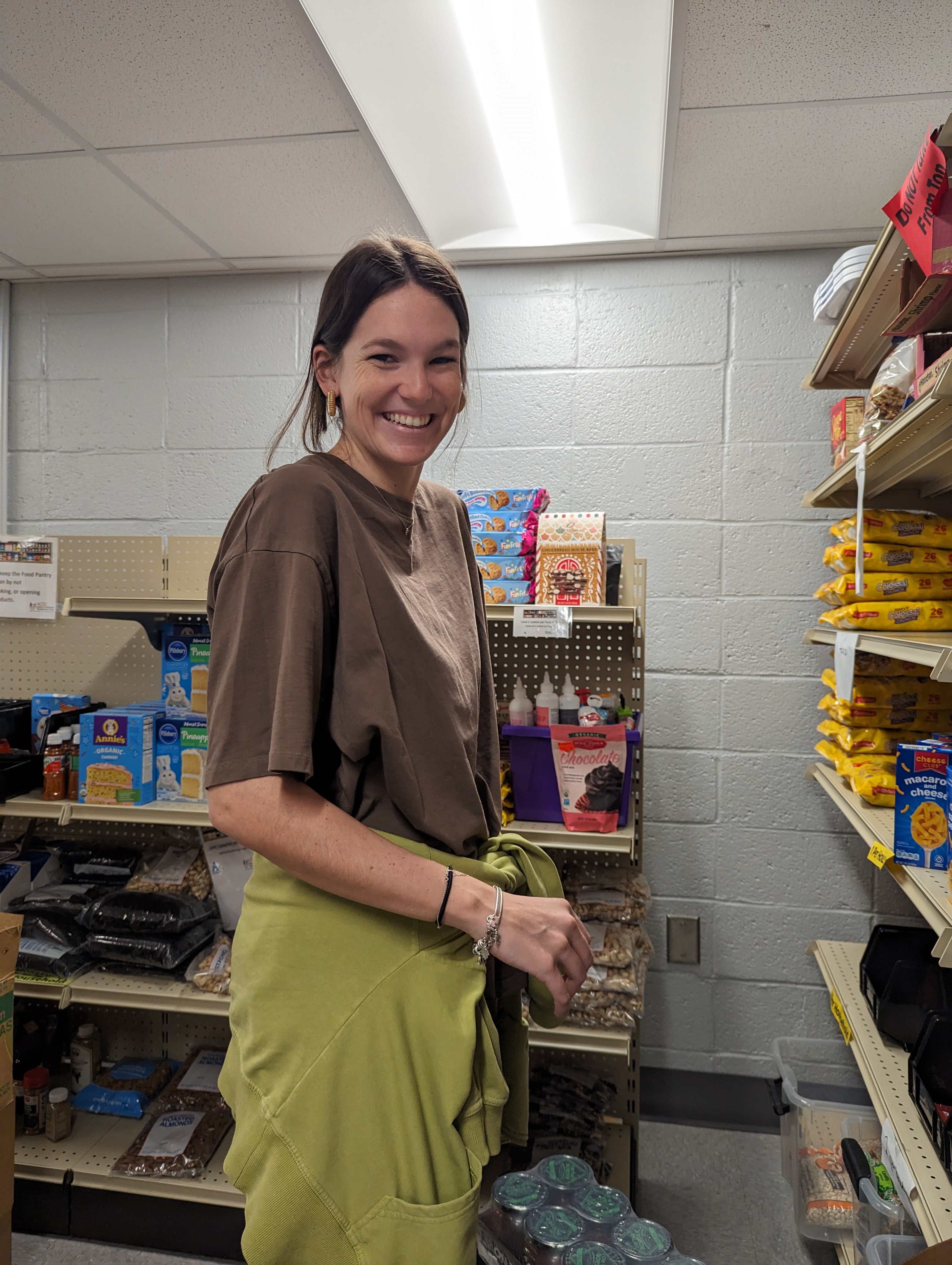 food pantry volunteers placing items on shelves