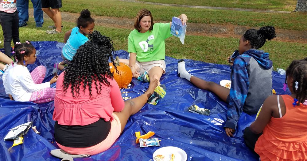 Volunteer reading to kids