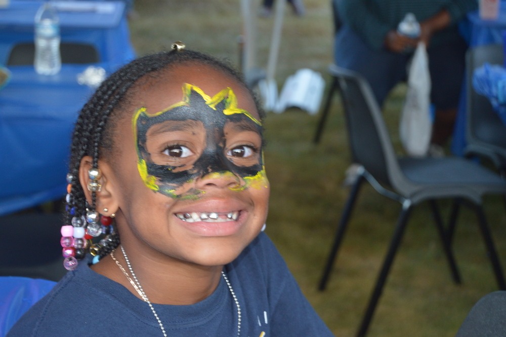 Girl with Batman face paint