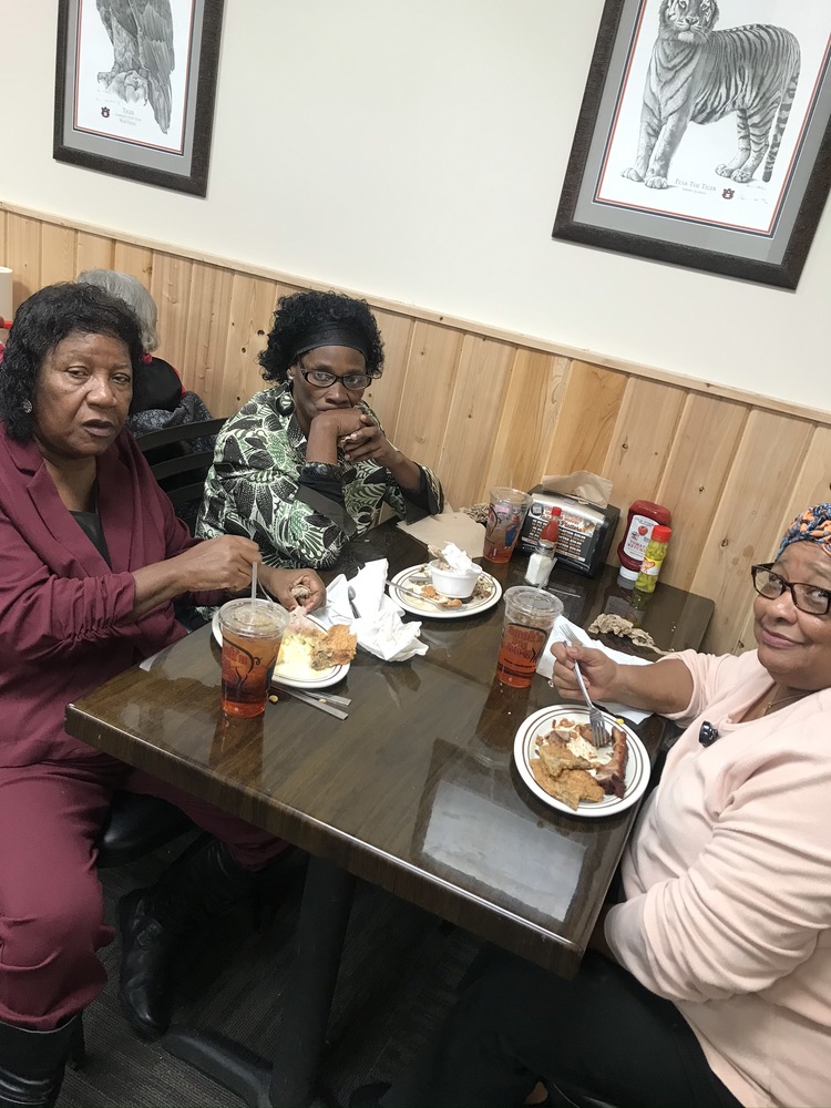 table of female residents eating at our holiday luncheon