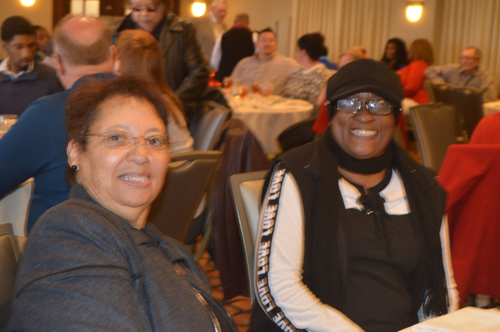 Female employees smiling at the Christmas Luncheon