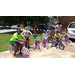 Youth posing for picture sitting on their new bikes.