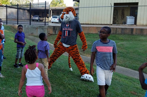 National Night out mascot Aubie the Tiger entertaining youth attendees. 