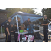 Auburn Police Department at National Night Out vendor table engaging with youth attendee.