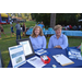 Circle of Care staff posing for picture at their National Night Out vendor table.