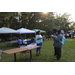 Community vendor speaking with National Night Out attendees about their programs.