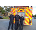 Auburn Emergency Staff are all smiles in front of fire truck.