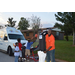 Youth residents shooting arcade style basketball outside at National Night out vendor table.