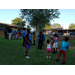 Youth and CEO Sharon Tolbert being entertained by Aubie the Tiger at National Night Out event.