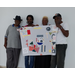 Senior Citizens posing for group picture with their designed quilt.