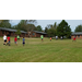 Youth listening to Church of the Highlands staff member explain field game instructions. 