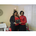 Star Paschal holding her 10 year employee anniversary plaque with CEO Sharon Tolbert 