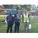 Maintenance Staff posing in front of tent and properties at AHA National Night Out