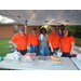 AHA Staff posing behind food table at National Night Out