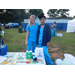 Lighthouse staff posing behind their vendor table