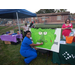 Healthcare officials color a Frankenstein display board