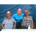 Commissioner White with residents in fire safety hats at National Night Out