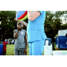 Individuals blowing up a balloon at National Night Out