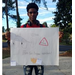 Elijah Jenkins holding her poster for Fire Prevention Week Poster Contest 