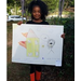 Florina Cristobal holding her poster for Fire Prevention Week Poster Contest 