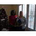 CEO Sharon Tolbert presenting employee Laura Squiers a 10 year anniversary plaque.