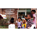 LaFayette Little Library Entrance with youth enjoying storytime