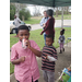 Youth enjoying drinks and snacks at the LHA Little Library opening