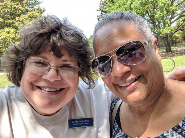 two elderly women smiling for camera